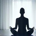Relaxed person meditating in a calm environment, symbolizing peace and good sleep